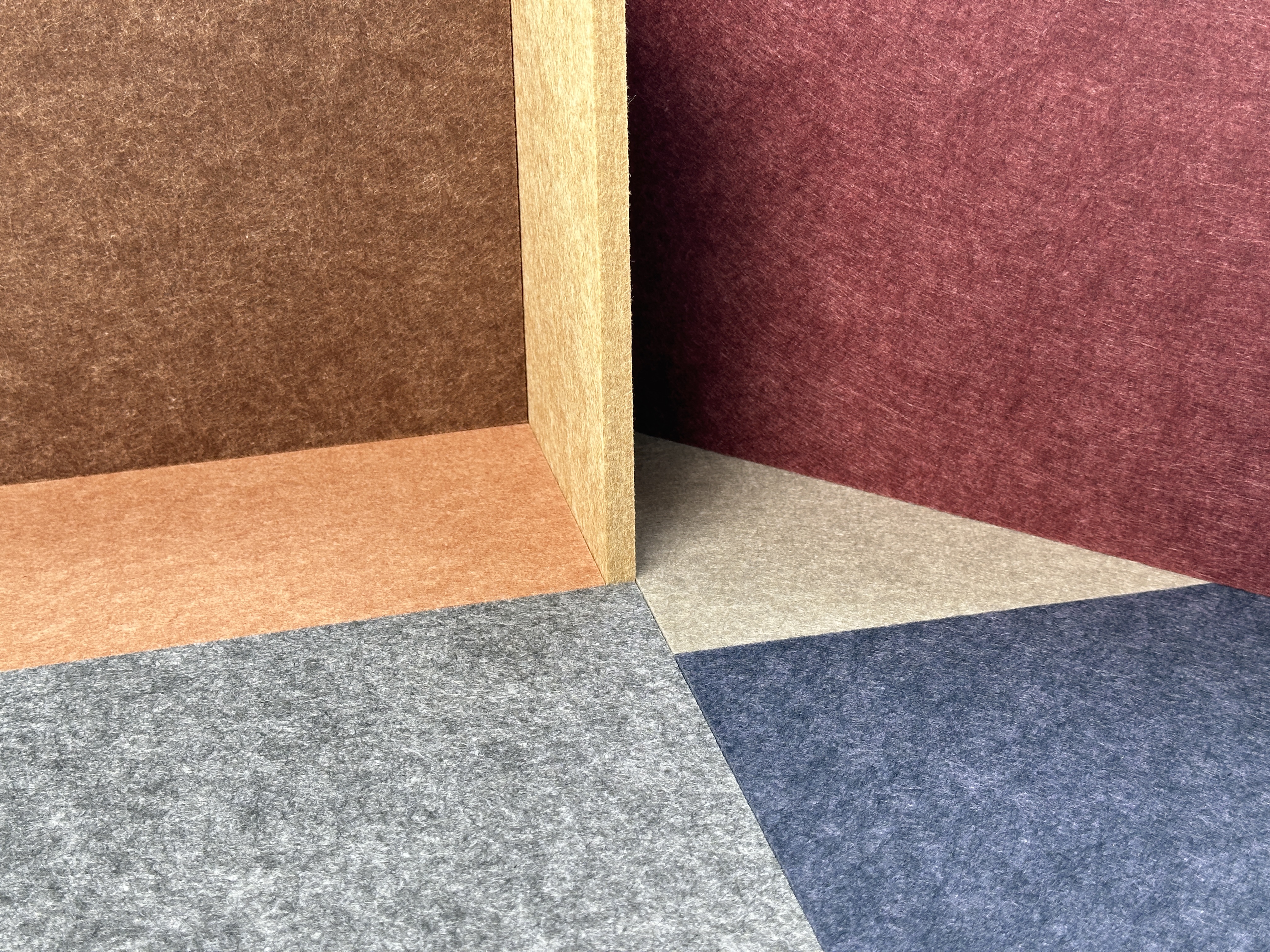 Installation of 9 mm PET felt acoustic panels in a modern office space